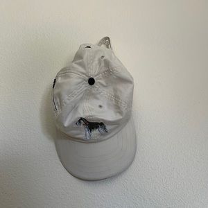 Adjustable hat with dog and side zipper